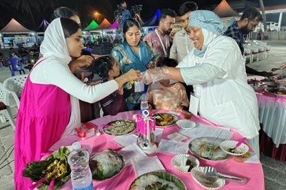 The photo shows attendees at the Matsya Mela meeting